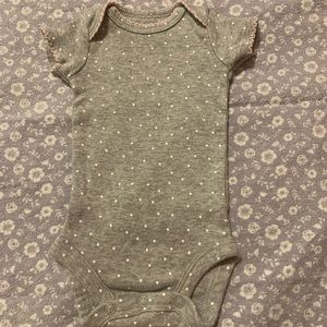 Grey with white polkadots jump suit. Cute unisex baby bodysuit